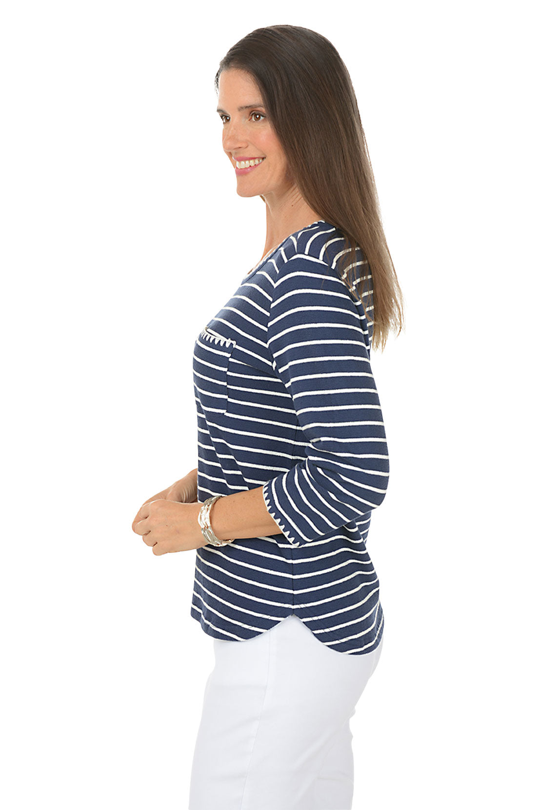 Woman wearing a navy and white striped shirt on a white background
