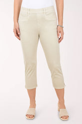 Person wearing beige capri pants on a white background
