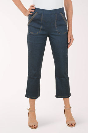 Person wearing dark blue jeans on a white background