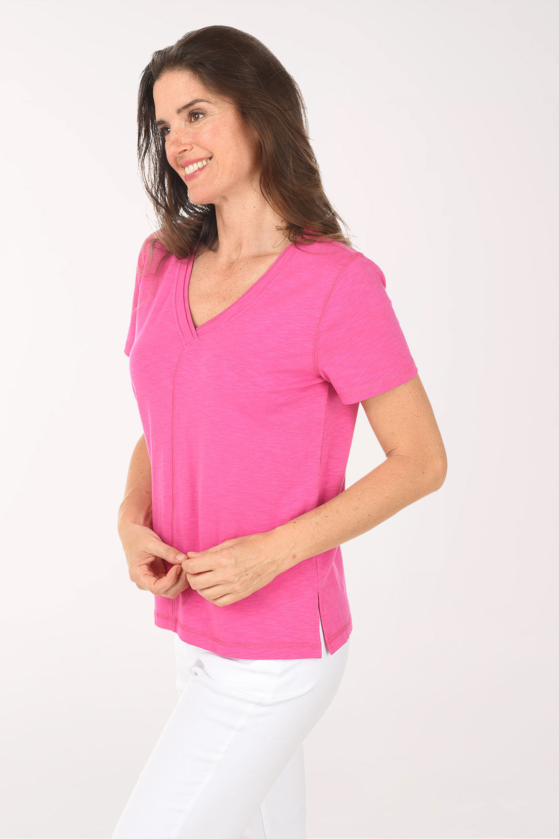 Woman wearing a pink t-shirt on a white background