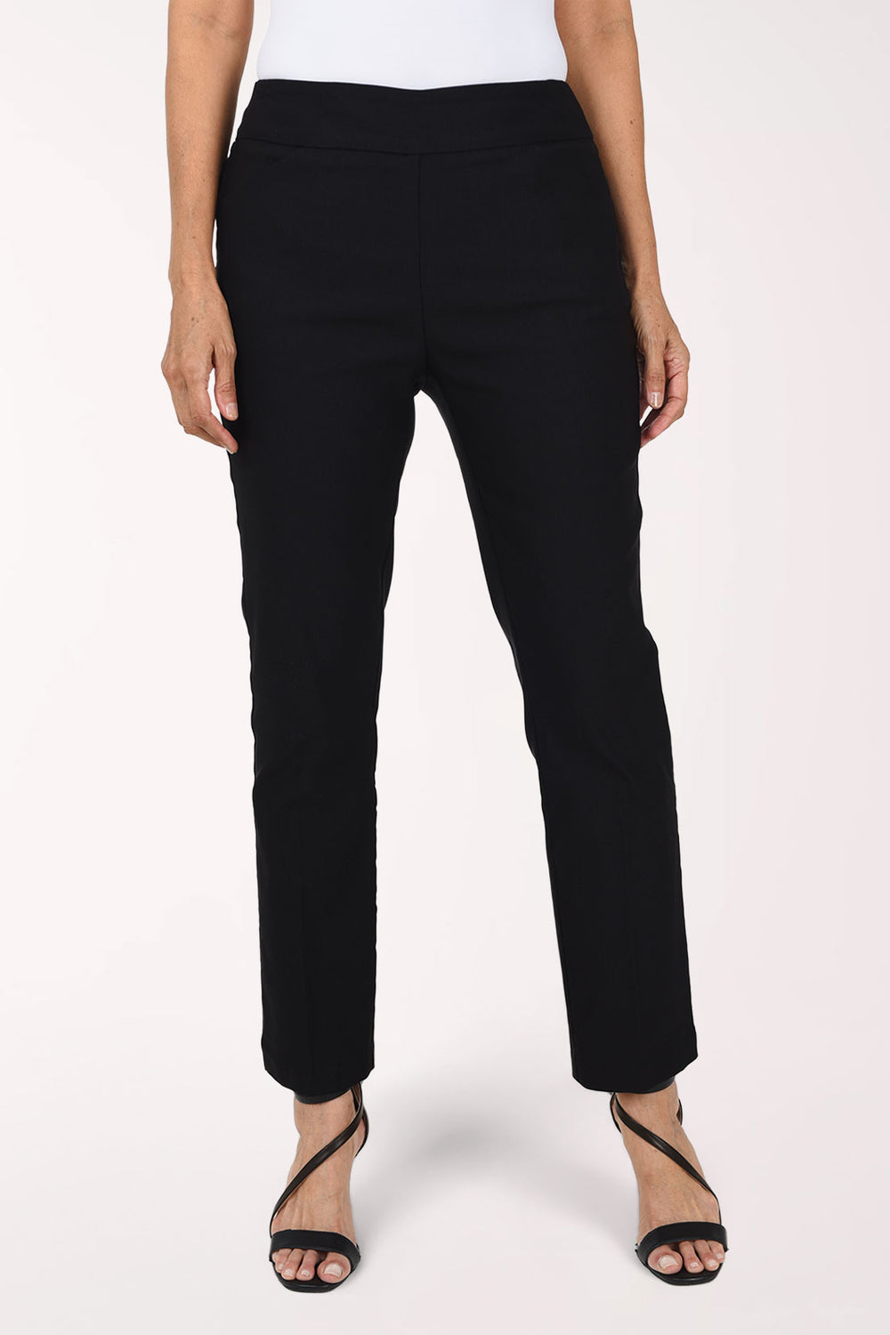 Woman wearing a black solid pull-on ankle pant