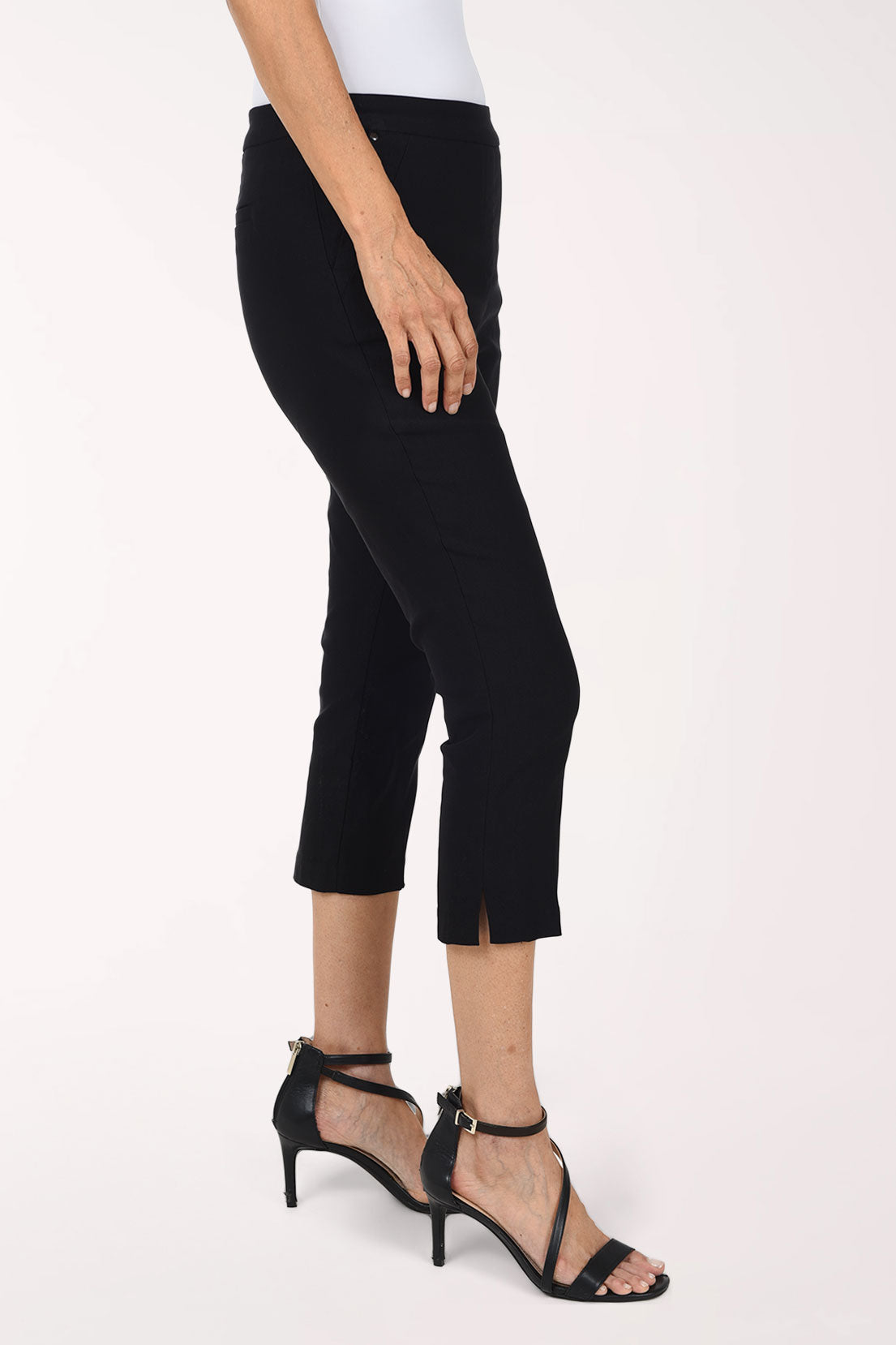 Woman wearing a black solid pull-on capri pant