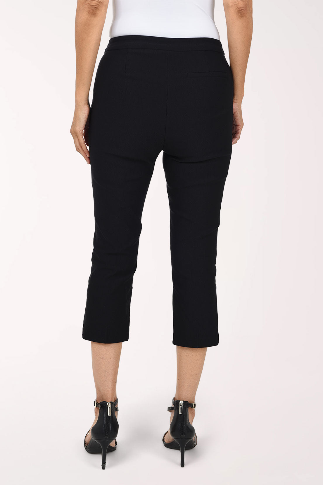 Woman wearing a black solid pull-on capri pant