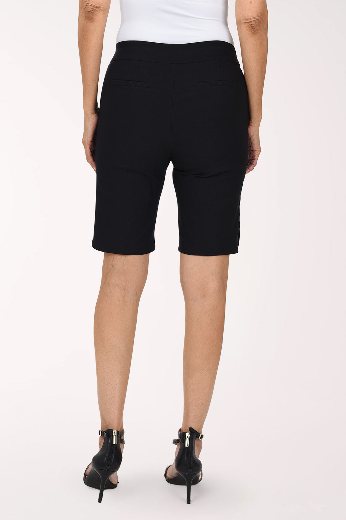 Woman wearing solid black bermuda shorts