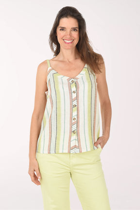 Woman wearing a striped sleeveless top and light green pants on a white background