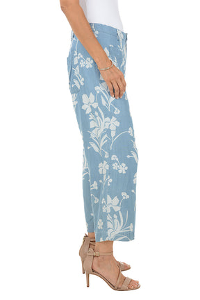 Light blue floral-patterned pants worn by a person on a white background
