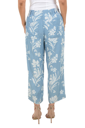 Light blue floral-patterned pants worn by a person on a white background