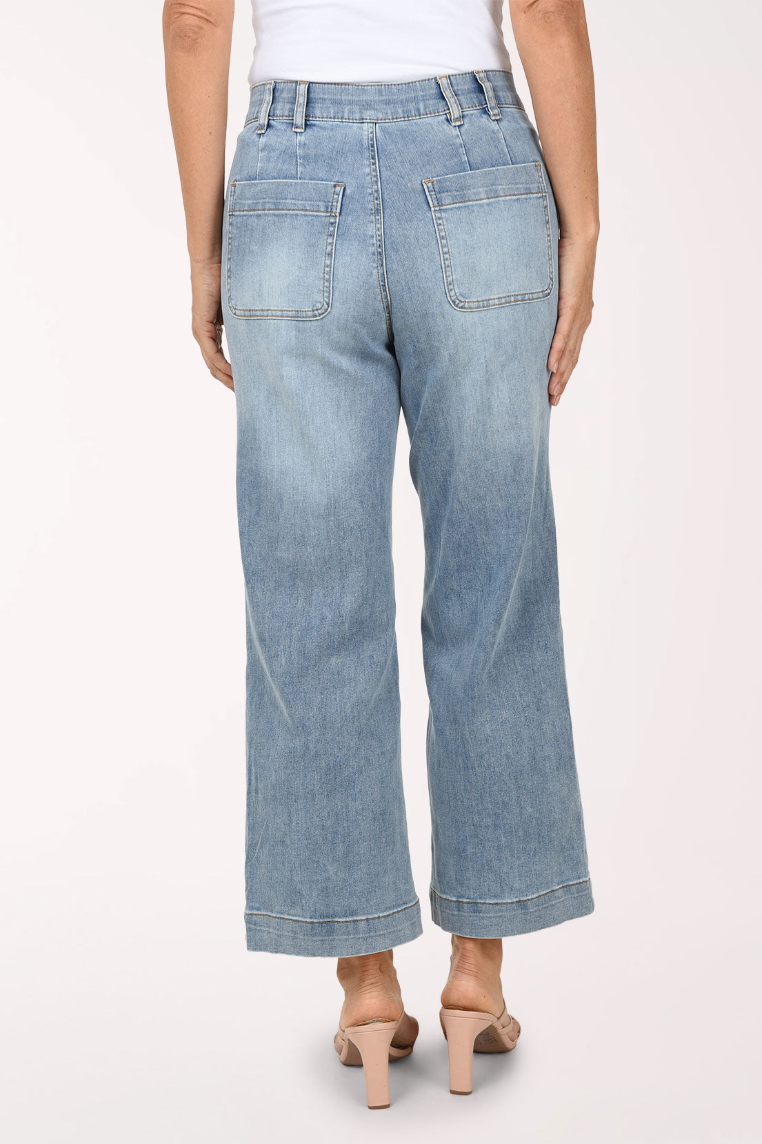 Back view of the light-wash Super Straight Patch Pocket Denim Pant showing the two back patch pockets and wide stitched hem.