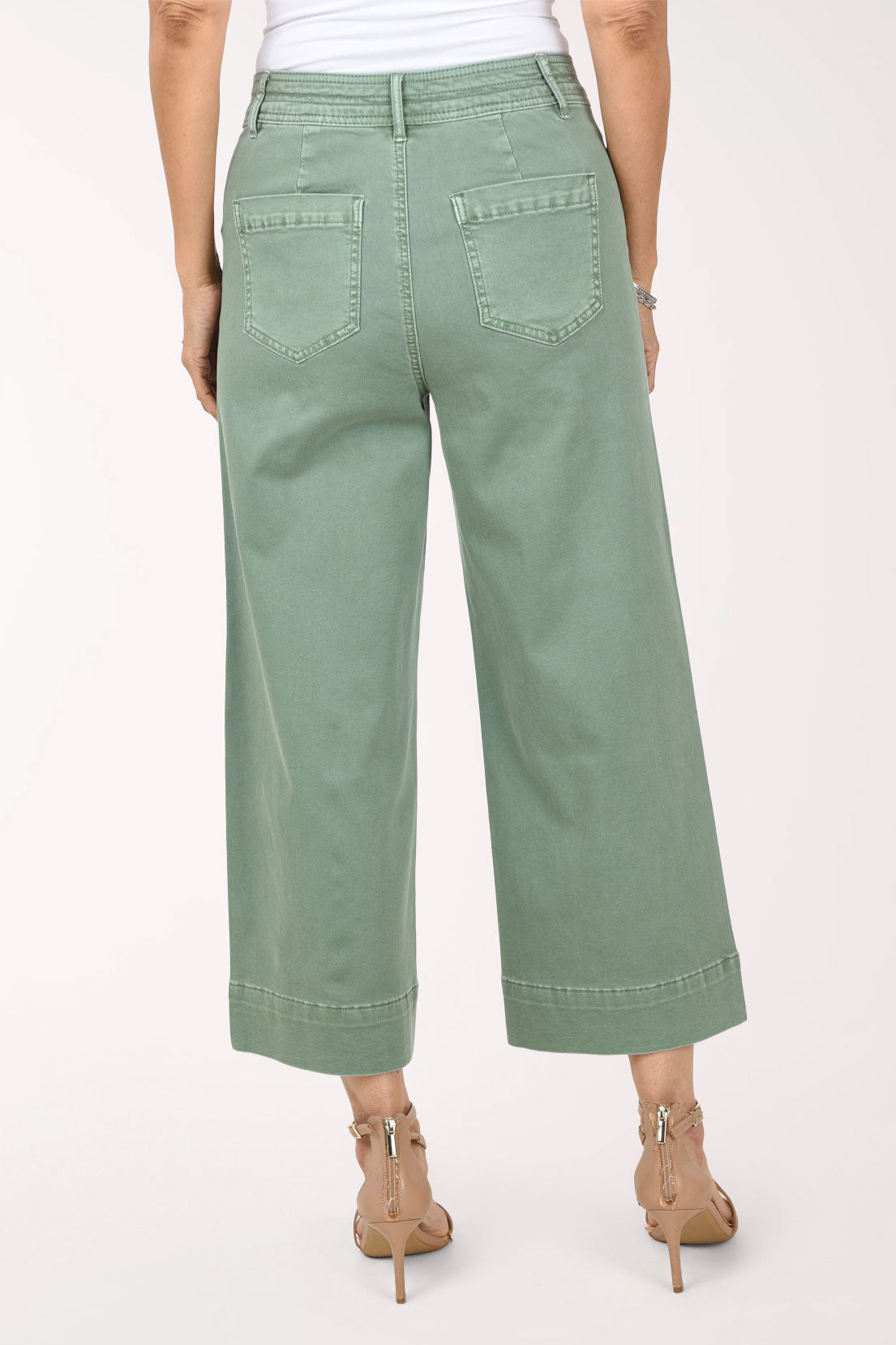 Back view of sage green Moss wide leg crop pants showing two back patch pockets, a topstitched yoke and the wide cropped leg.