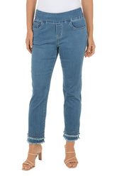 Blue jeans worn by a person on a white background.