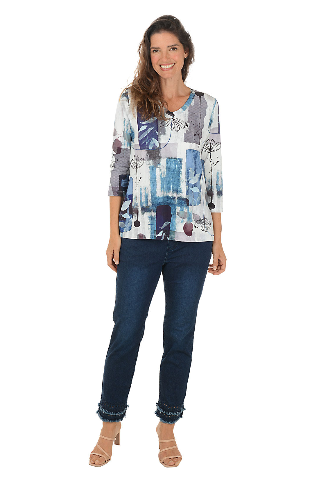 Person wearing dark blue jeans with a white background. Full length shot.