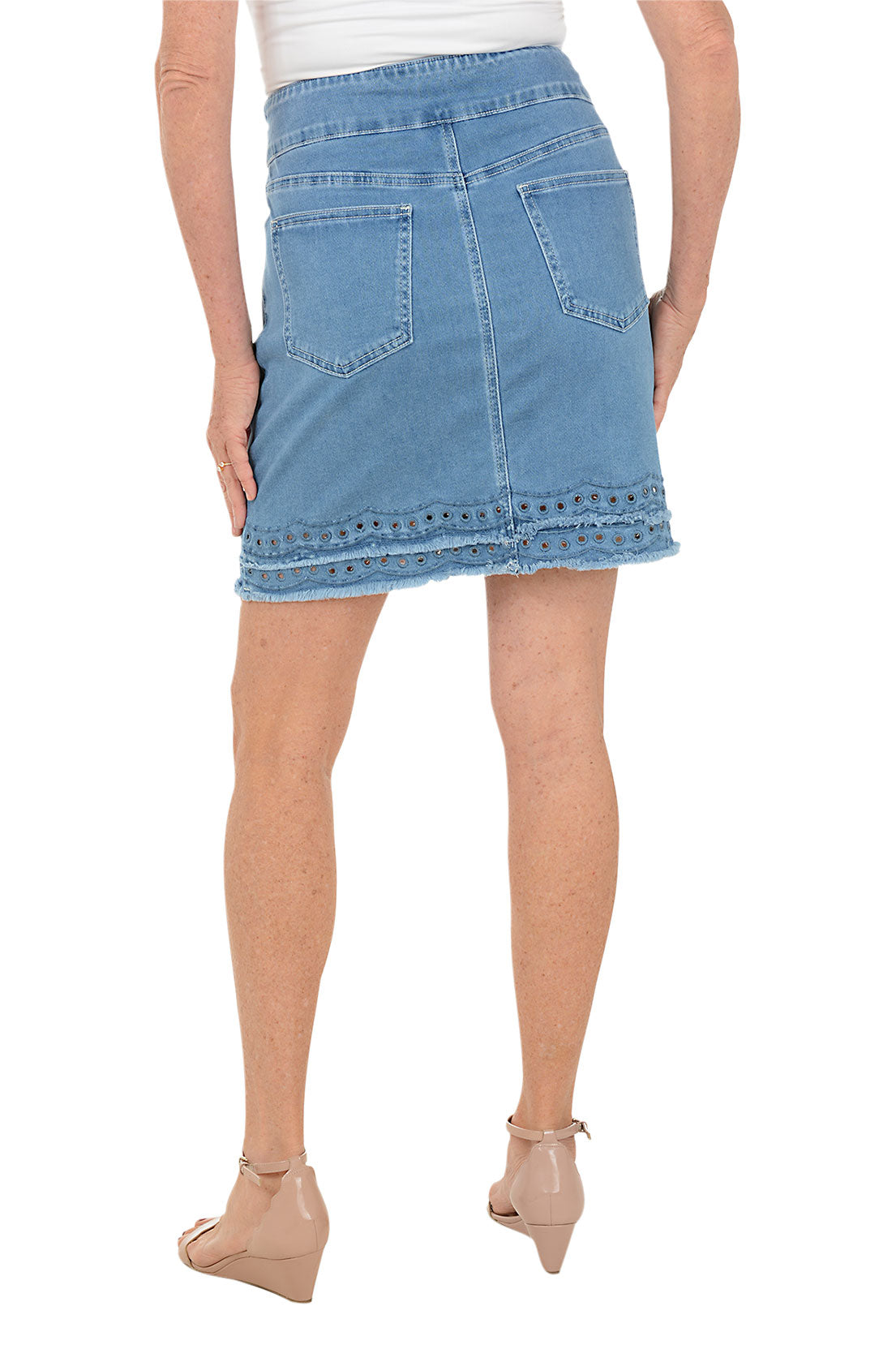 Light blue denim skirt worn by a person on a white background. Back shot.