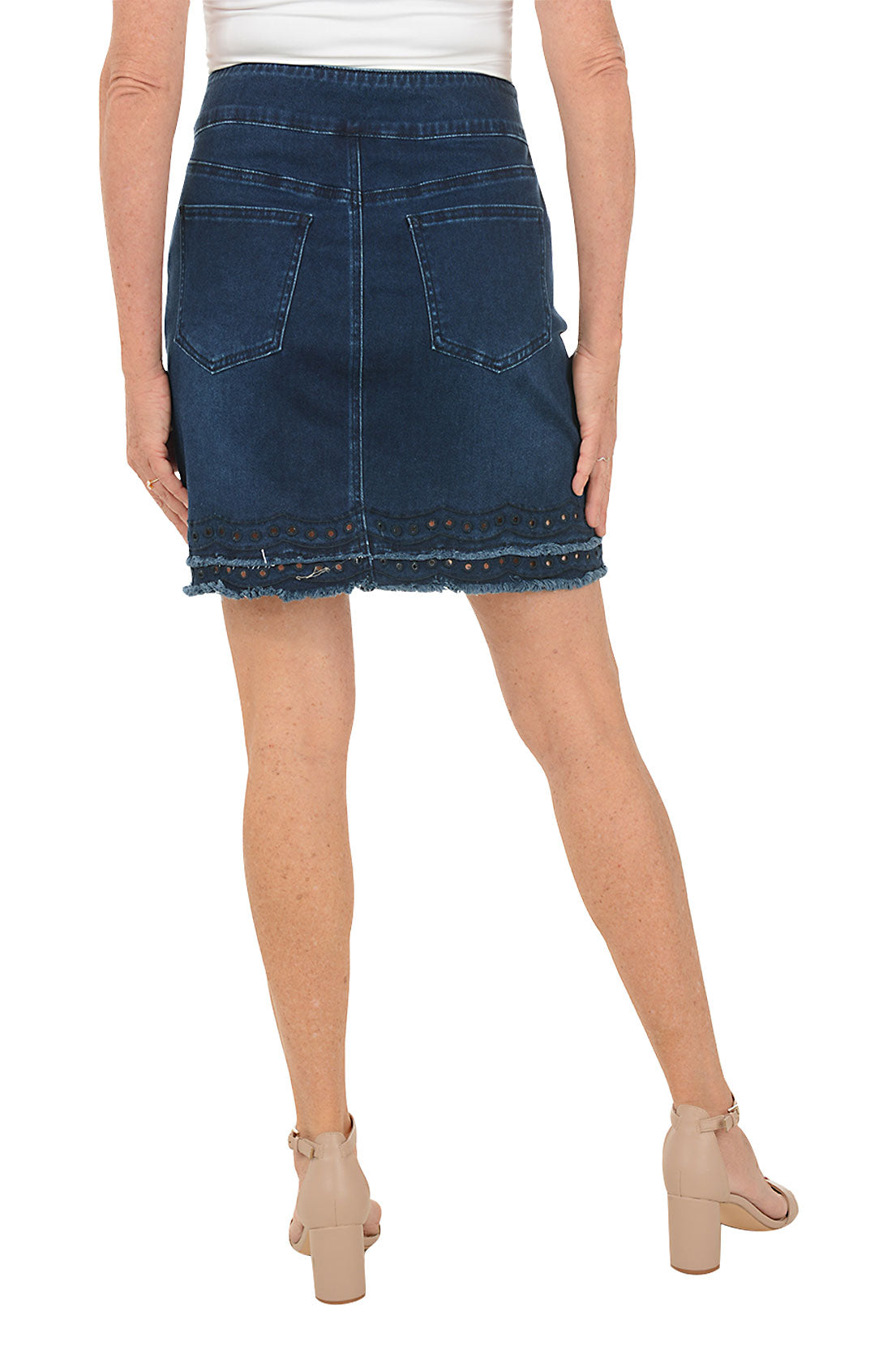 Person wearing a blue denim skirt on a white background. Back shot.