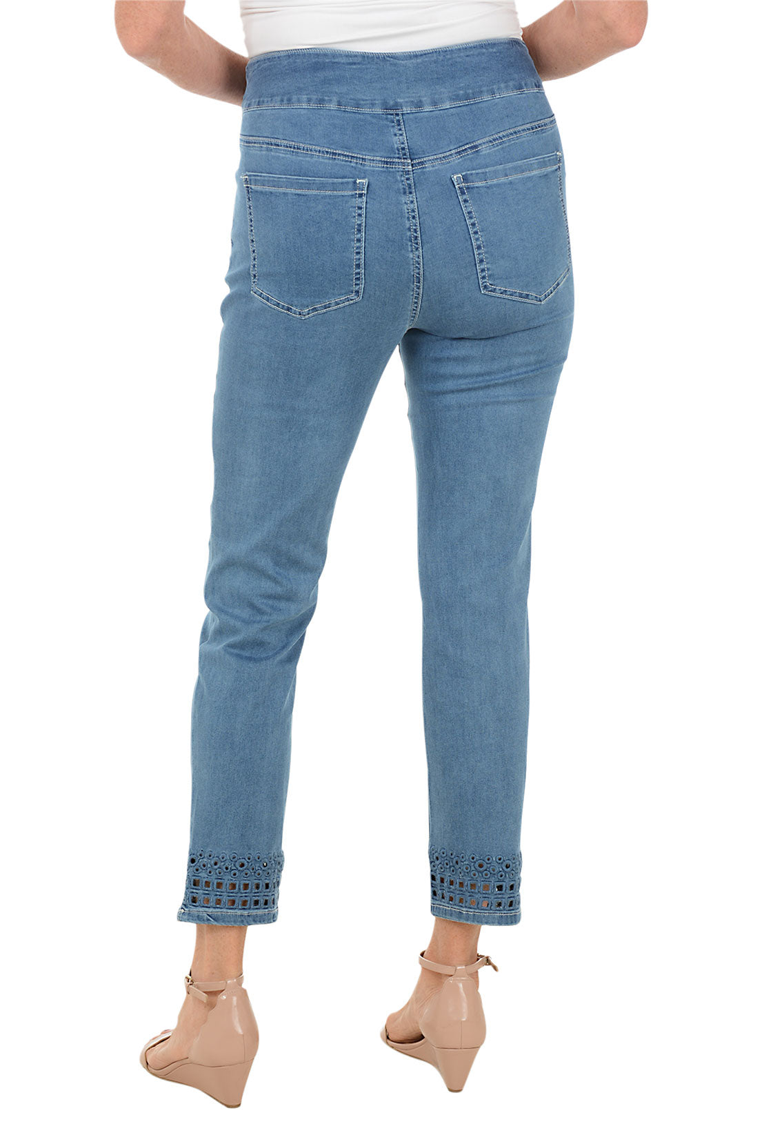 Light blue jeans worn by a person on a white background. Back shot.