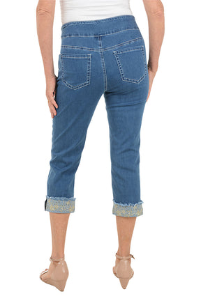 Blue jeans worn by a person on a white background. Back shot.