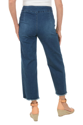 Blue jeans with a slit on a white background. Back shot.