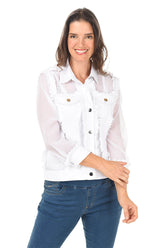 Woman wearing a white blouse with ruffled details and blue jeans on a white background