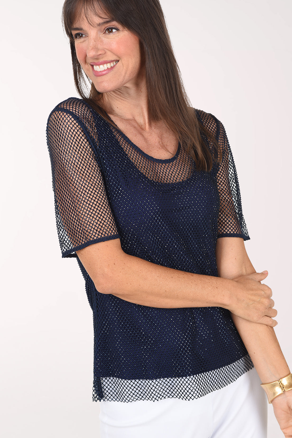 Close-up of the navy rhinestone mesh blouse showing the sheer short sleeves, sparkling mesh overlay and inner tank.