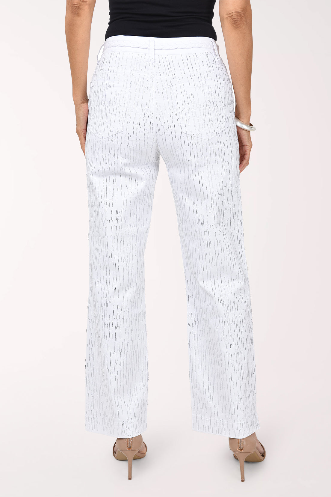 Back view of the white rhinestone denim pants showing the braided waistband, back pockets and rhinestone rows down the legs.