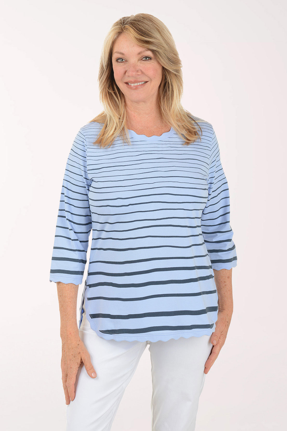 Woman wearing a blue and white striped shirt on a white background