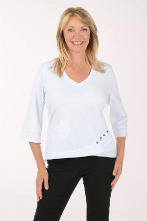 Woman wearing a white blouse with black pants on a white background