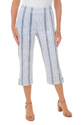 Blue and white striped pants worn by a person on a white background