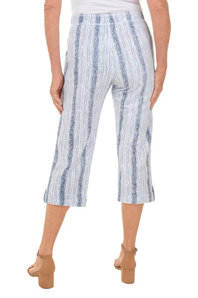 Blue and white striped pants worn by a person on a white background. Back shot.