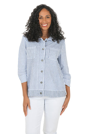 Woman wearing a blue and white striped shirt on a white background.
