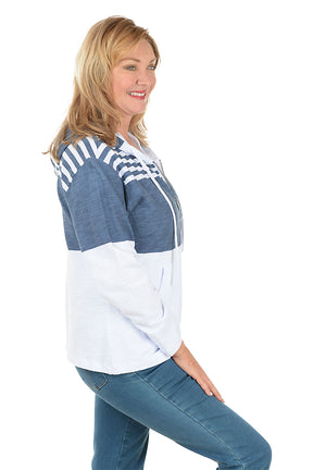 Woman wearing a blue and white striped hoodie on a white background. Side shot.