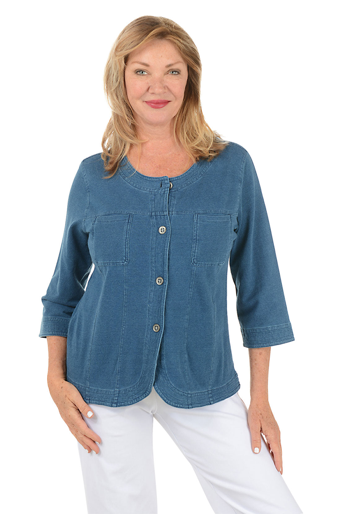 Woman wearing a blue denim shirt with a white background.