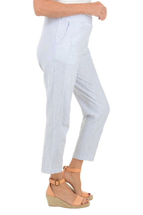 White pants with blue stripes worn by a person on a white background. Side shot.