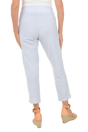 White pants with blue stripes worn by a person on a white background. Back shot.