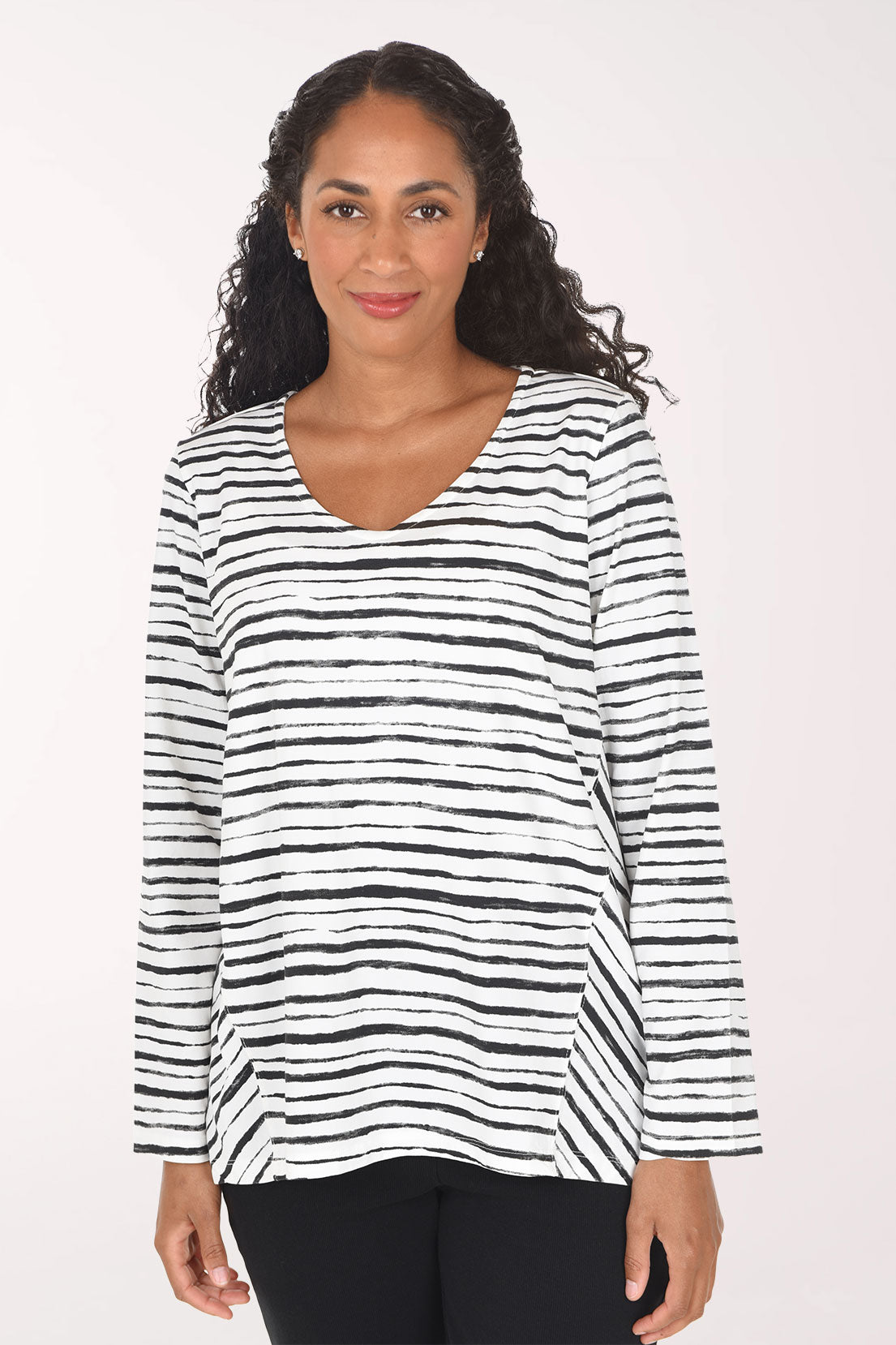Woman wearing a black and white striped long sleeve top
