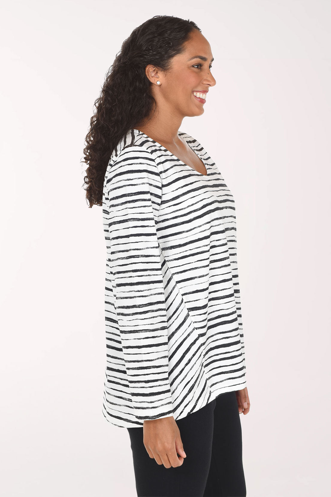 Woman wearing a black and white striped long sleeve top