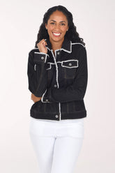 Woman wearing a black denim button down jacket with contrast stitching and fringing