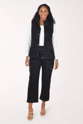 Woman wearing black denim cargo pants 