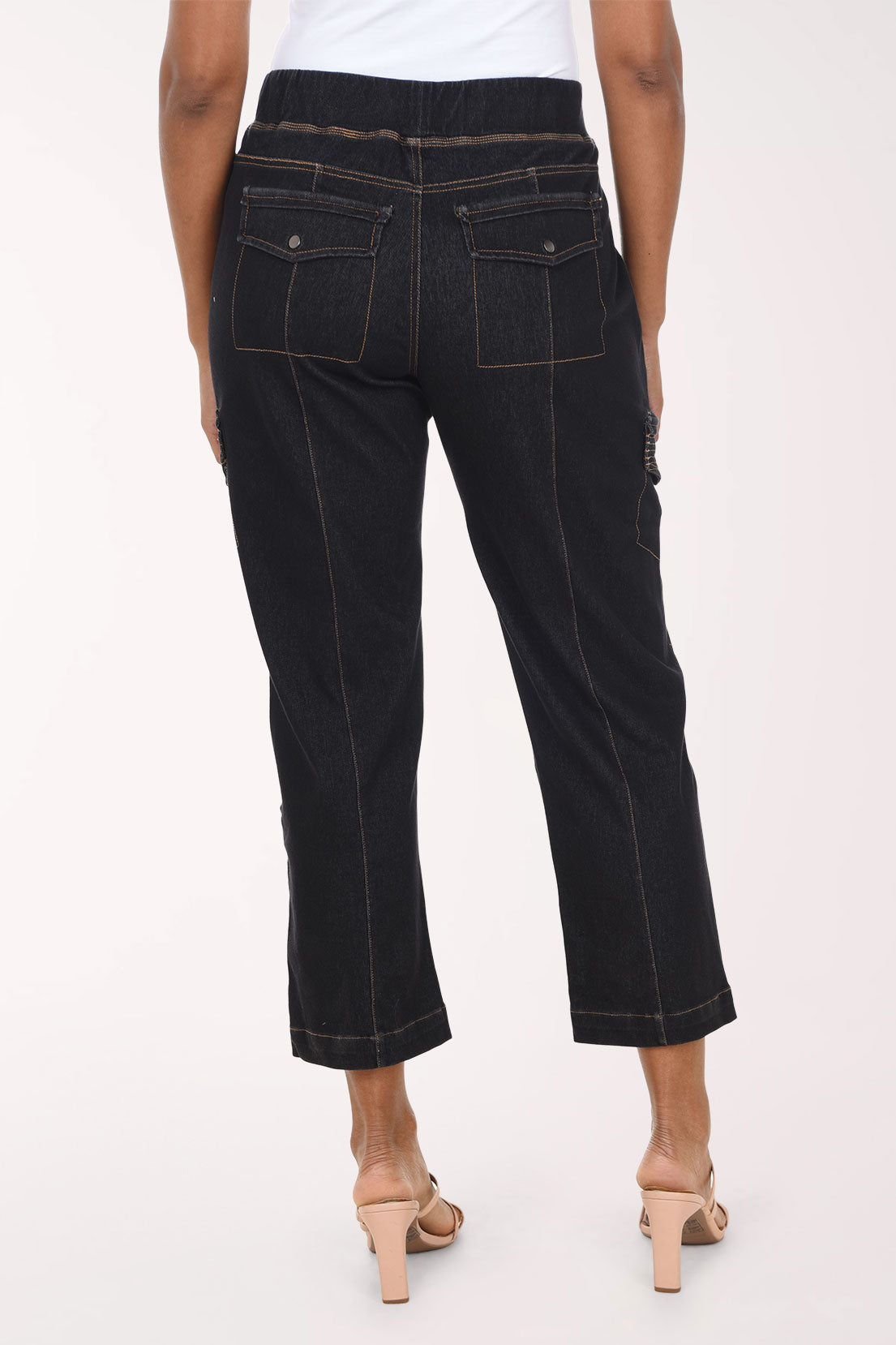 Woman wearing black denim cargo pants 