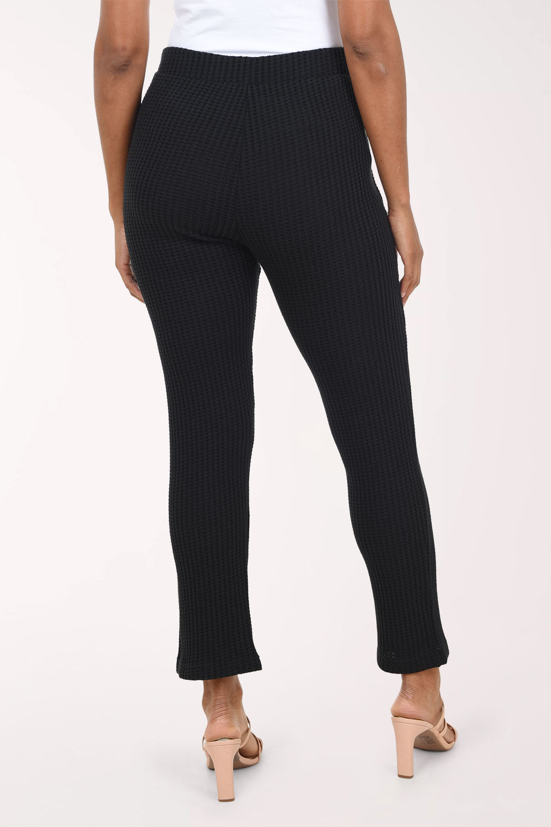 Woman wearing pull-on black cropped pants