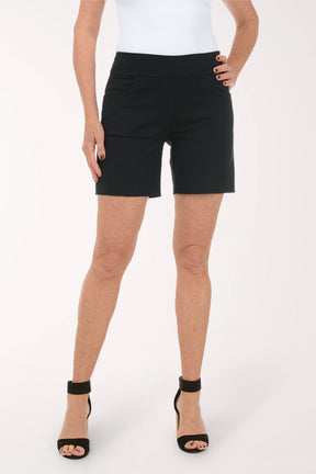 Person wearing black shorts on a white background