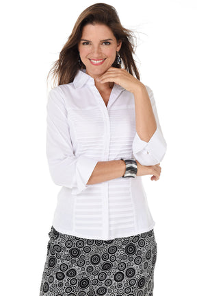 Woman wearing a white blouse with rolled-up sleeves on a white background