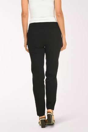 Person wearing black pants and a white top on a white background