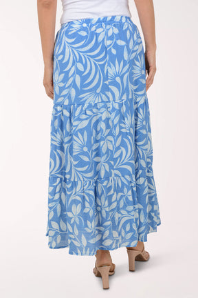Blue floral skirt worn by a person on a white background