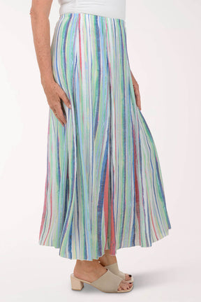 Multicolored striped skirt worn by a person on a white background
