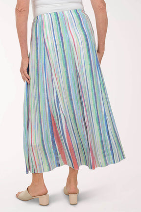 Multicolored striped skirt worn by a person on a white background