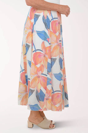 Floral patterned skirt worn by a person on a white background
