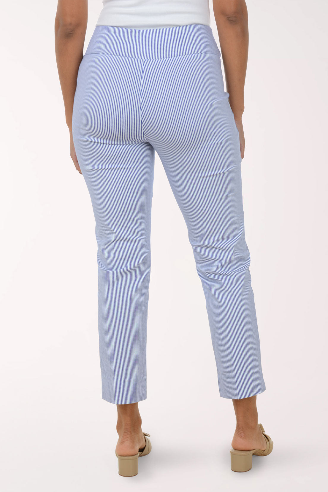 Person wearing blue striped pants on a white background