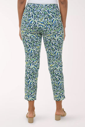 Woman wearing a patterned green and blue pants on a white background