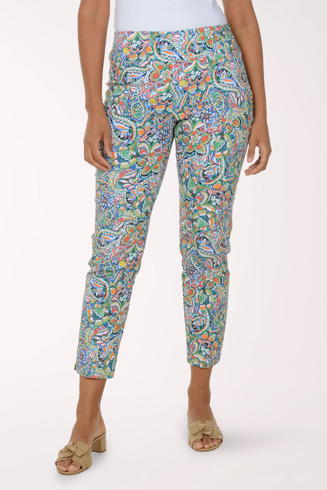 Colorful patterned pants worn by a person on a white background