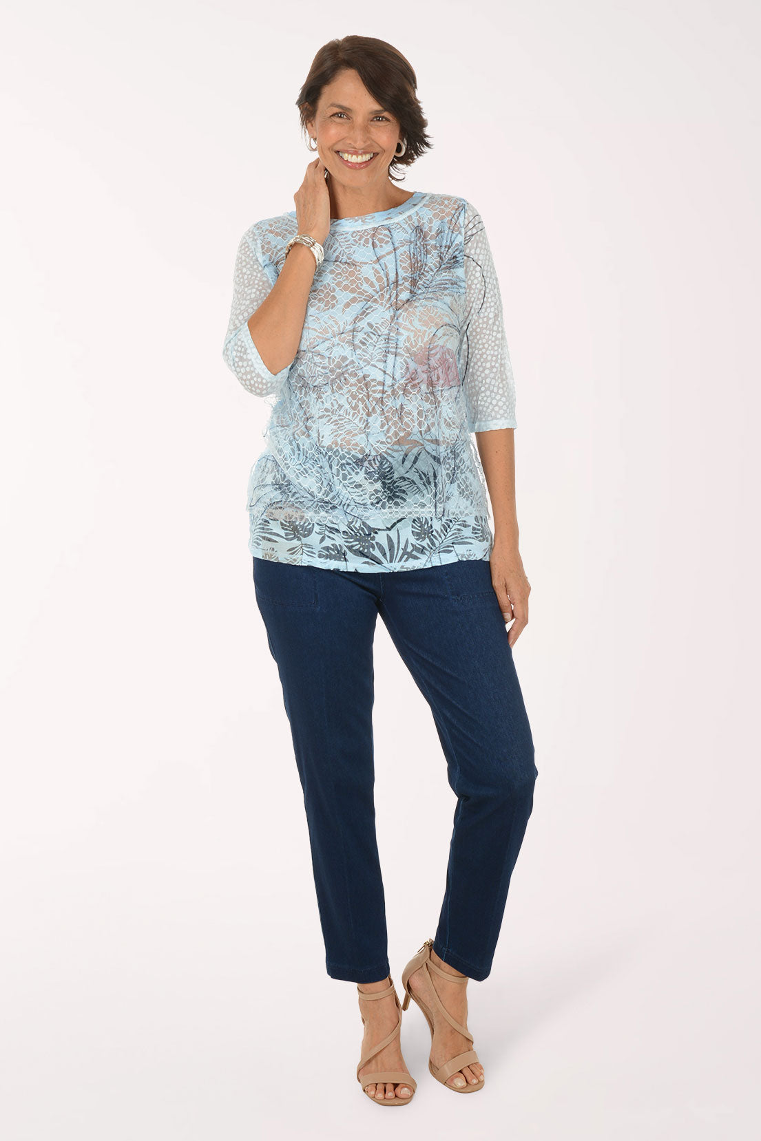Model wearing the Zac and Rachel Drawstring Relaxed Denim Pant in Dark Wash with a light blue printed top and nude sandals, front view