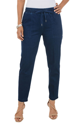 Dark blue wash jogger pants worn by a person on a white background